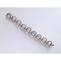 Important bracelet en métal argenté